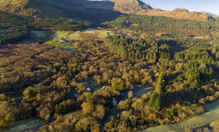 An aerial view of cabins nestled in the trees at Beddgelert.